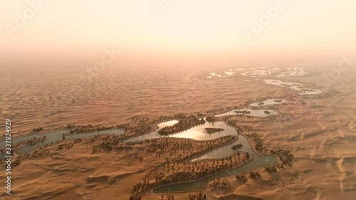 Artificial lakes in Dubai desert. United Arab Emirates nature. Top view. Best angle Sunset aerial view. Expo2020 concept