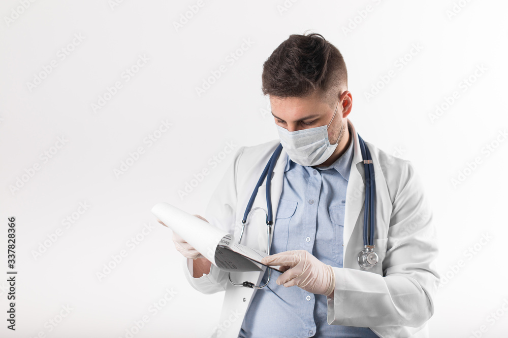 European doctor with stethoscope and mask check patient blood test European doctor with stethoscope and mask check patient blood test