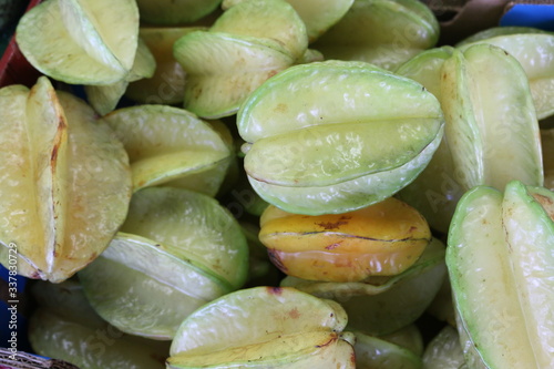 a large pile of star fruit photo