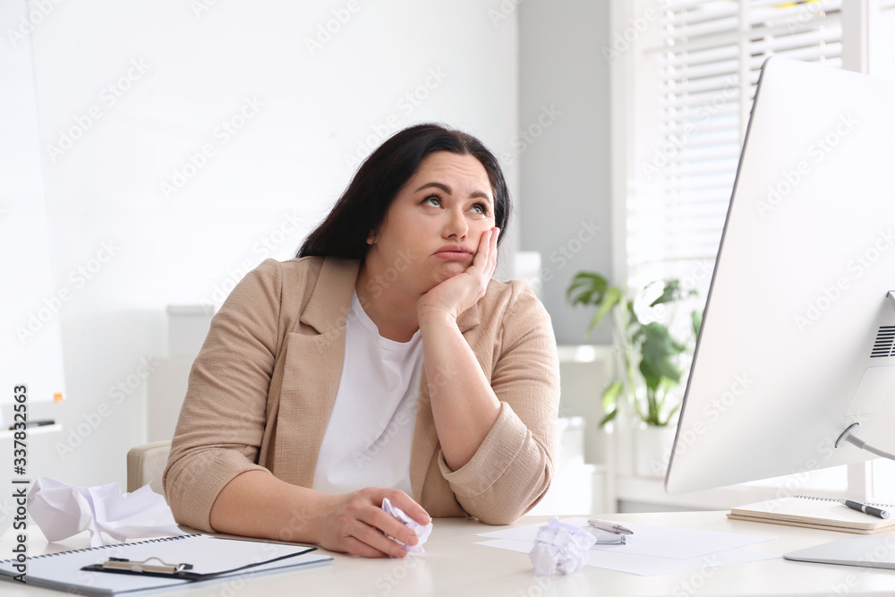 Lazy overweight worker at white desk in office Lazy overweight worker at white desk in office