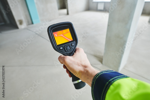 thermal imaging camera inspection for temperature check and finding heating pipes photo