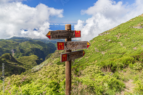 A route and direction indicator on a hiking trail in the mountains of Madeira, Portugal.