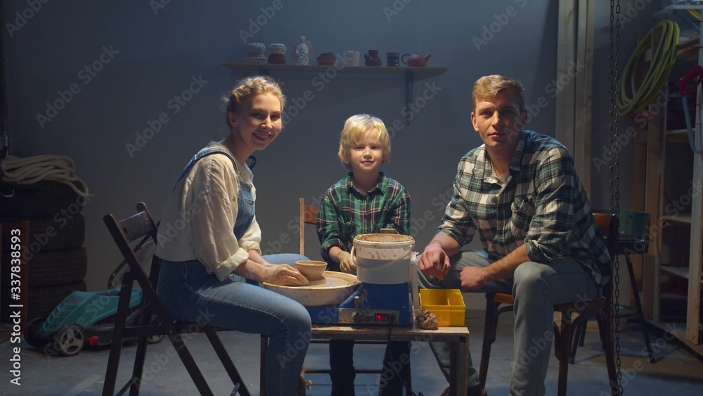 The family spends time together in the workshop The family spends time together in the workshop