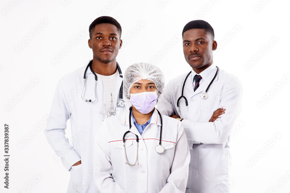 Three doctors on a white background. Indian woman with a phonendoscope.African men. Three doctors on a white background. Indian woman with a phonendoscope.African men.
