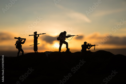 War Concept. Military silhouettes fighting scene on war fog sky background,