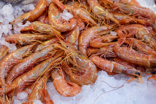 Freshly caught depp-water rose shrimps or Parapenaeus longirostris on the counter at the greek fish market in Athens on April.