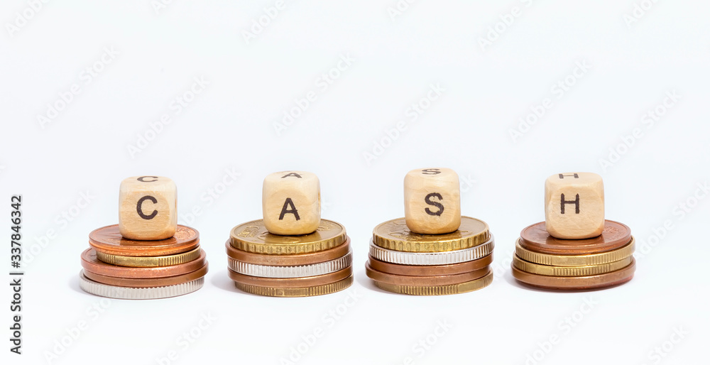 Cubes with the word CASH are on coins, concept Cubes with the word CASH are on coins, concept