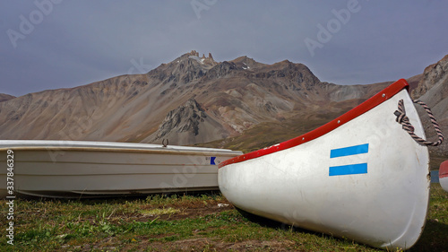 canoes near the lake in the mountains