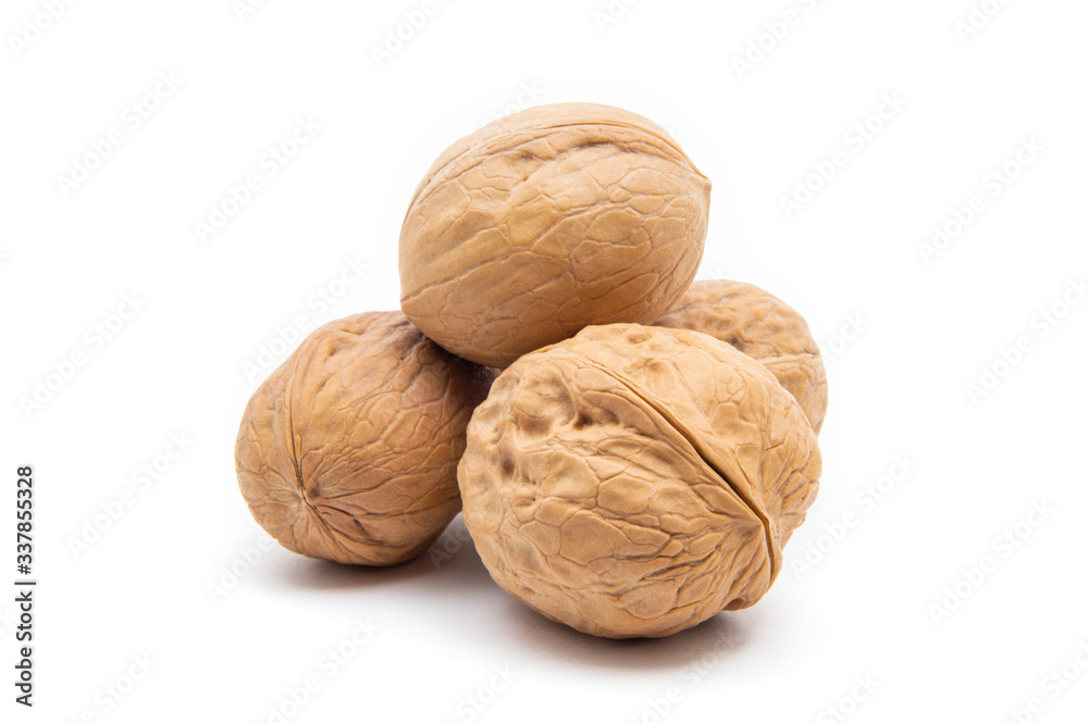 Ripe four whole walnuts, isolated on white background Ripe four whole walnuts, isolated on white background
