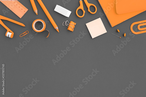 School supplies on grey background. Crreative flat lay. photo