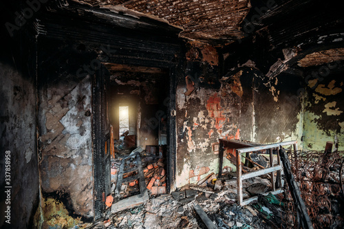 Burnt old rural house interior. Consequences of fire