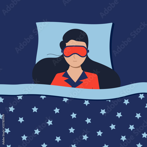 Woman with sleepeing mask sleeping at night in bed at home or in hotel.