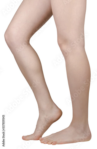 bare feet of a girl with flat feet, one leg on tiptoe, side view isolated on a white background