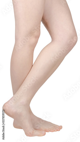 bare feet of a girl with flat feet, one foot on tiptoe, the inside of the foot is seen, side view isolated on white background © Alexey Wraith