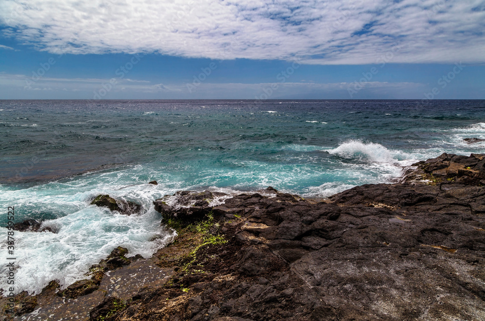 stonesl beach under blue sky