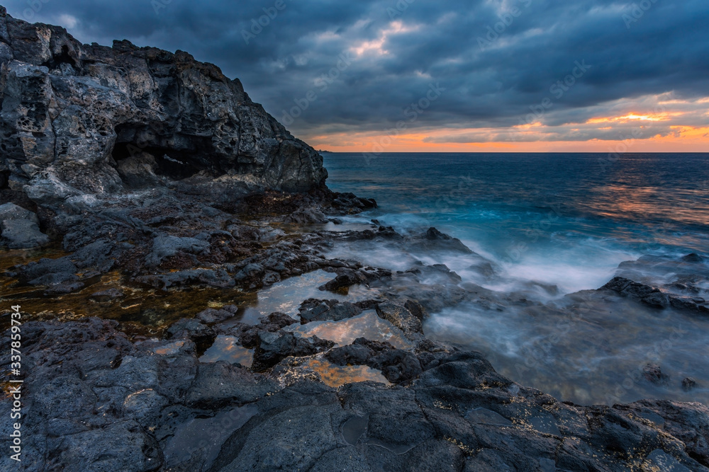 sea sunset at volcanic stones  beach
