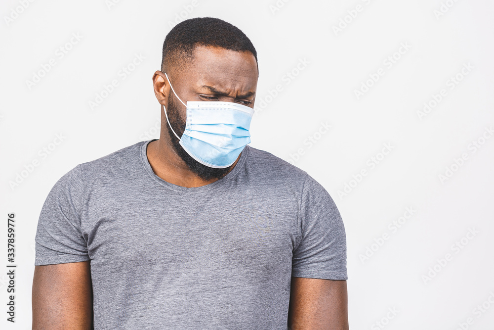 Coronavirus. African american man wearing hygienic mask to prevent infection, airborne respiratory illness such as flu, 2019-nCoV. Isolated on white background. Coronavirus. African american man wearing hygienic mask to prevent infection, airborne respiratory illness such as flu, 2019-nCoV. Isolated on white background.