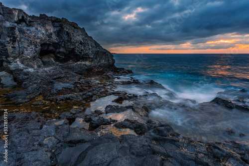 sea sunset at volcanic stones beach