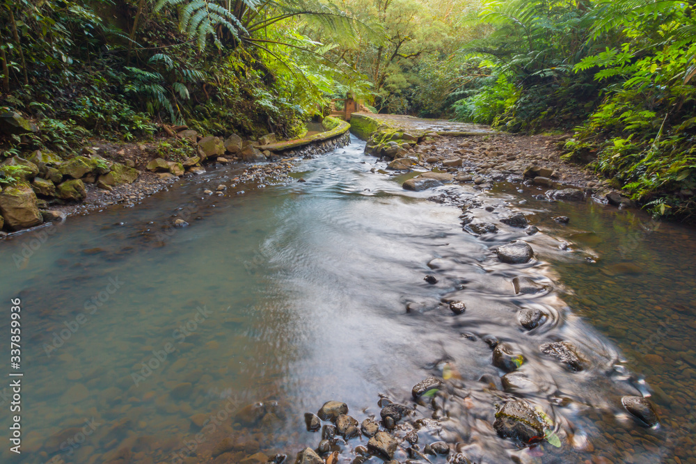 Ho'olawa Stream Flows Through an Iriigation Flume in The Ko'olau Rain Forest, Maui, Hawaii, USA Ho'olawa Stream Flows Through an Iriigation Flume in The Ko'olau Rain Forest, Maui, Hawaii, USA