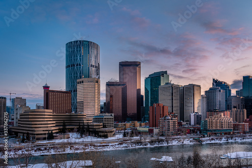 Calgary's skyline at night along the Bow River. 