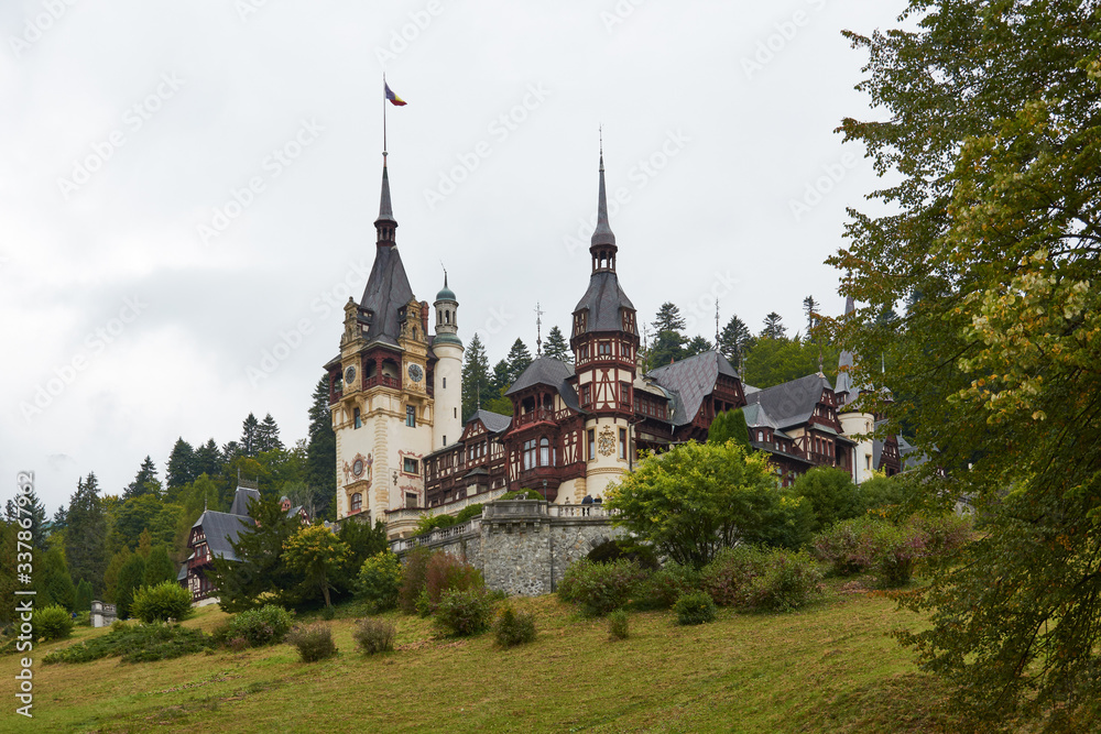 Peles Castle, residence of King Charles I in Sinaia, Romania. Autumn landscape of royal palace and park.