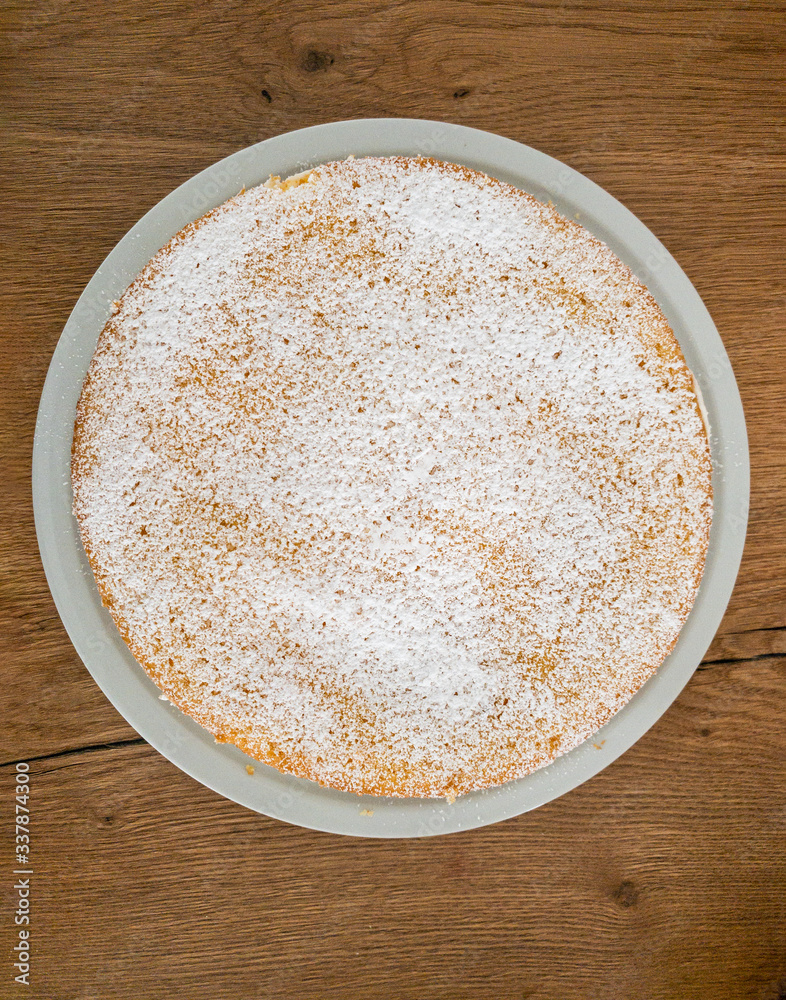 A complete, uncut delicious Cheesecake from top view. A complete, uncut delicious Cheesecake from top view.