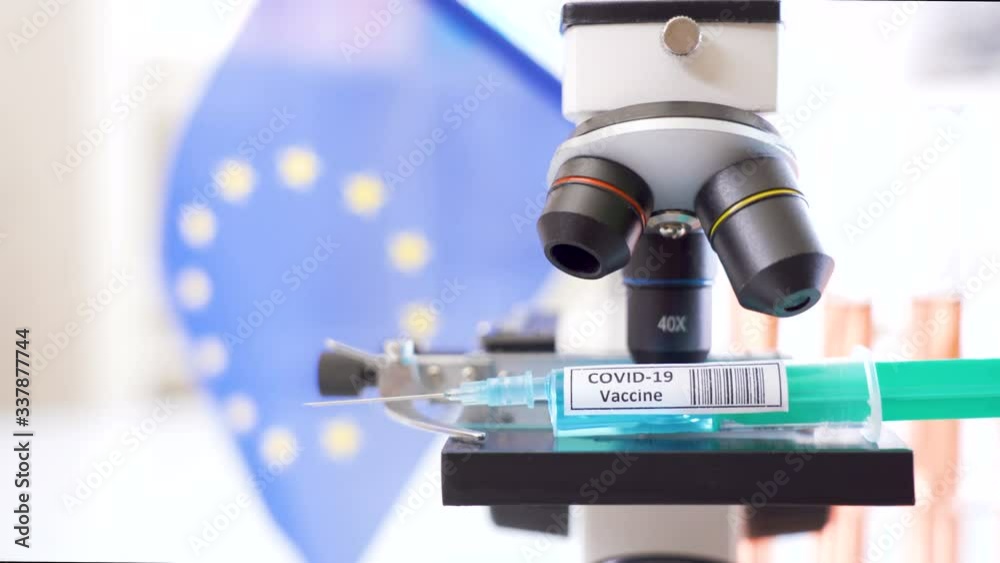The EU flag with the syringe for coronavirus vaccine COVID-19 The EU flag with the syringe for coronavirus vaccine COVID-19