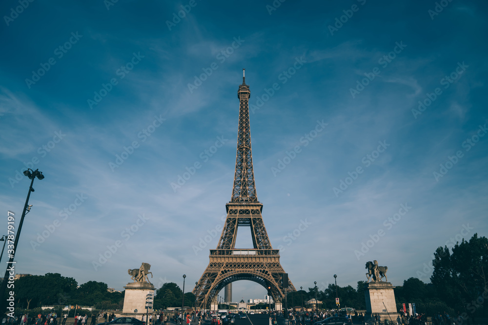 Eiffel Tower on crowded street