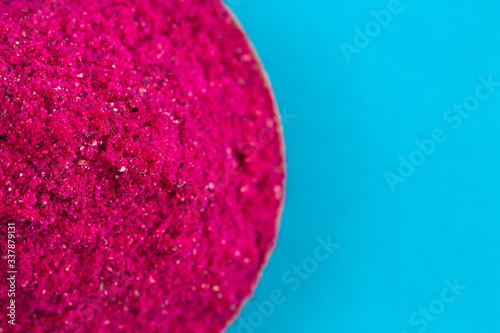 Pink Dragonfruit Powder on a Bright Blue Background