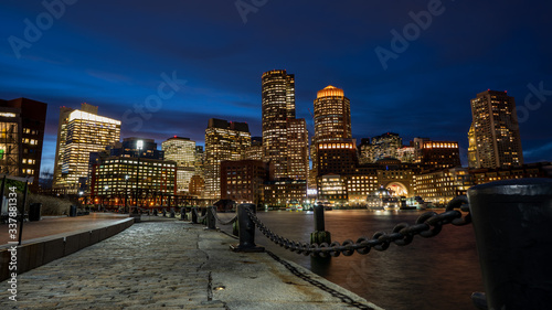 Boston Harbor and Financial District skyline at sunset in Boston, Massachusetts USA