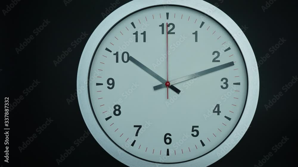 Close up Move the camera angle from right to left, Ten o'clock Gray wall watch on black background, Time lapse 60 minutes moving fast, Time concet.