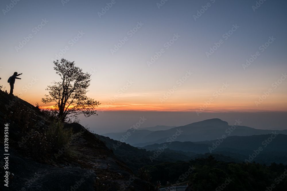 Twilight and morning sun at a viewpoint in the mountains of northern Thailand on a new day Twilight and morning sun at a viewpoint in the mountains of northern Thailand on a new day