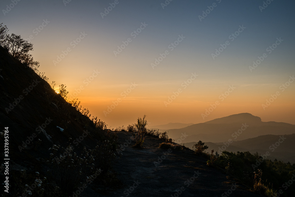 Twilight and morning sun at a viewpoint in the mountains of northern Thailand on a new day Twilight and morning sun at a viewpoint in the mountains of northern Thailand on a new day