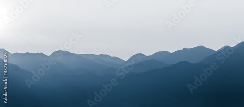 Fototapeta Naklejka Na Ścianę i Meble -  Continuous mountains. The mountain background of Chinese painting.