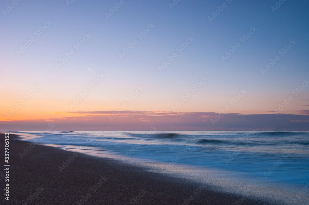 Long exposure by the North Sea at Sunset, Belgium Long exposure by the North Sea at Sunset, Belgium