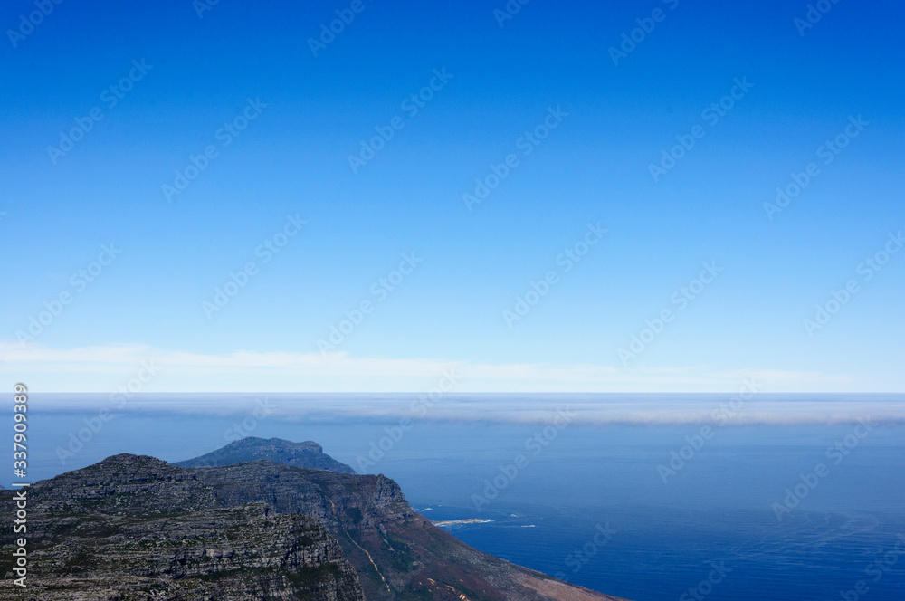 Scenic View Of Sea Against Blue Sky - obrazy, fototapety, plakaty 