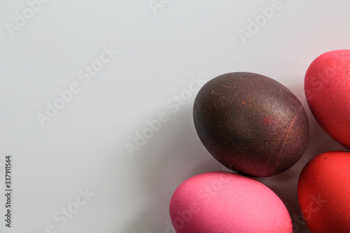 Easter eggs in red shades on a white background