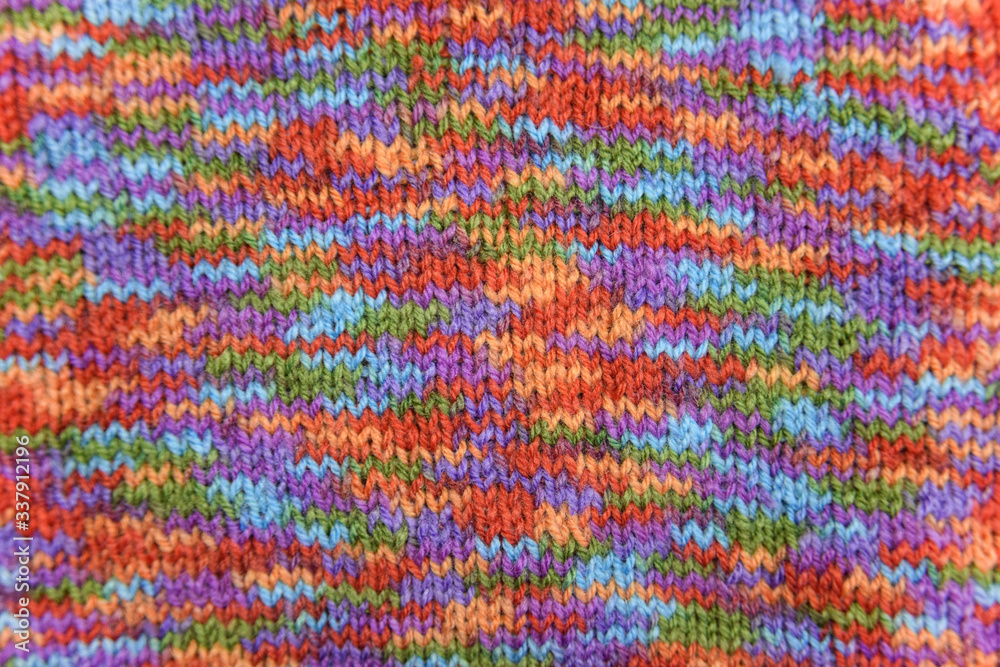 Bright colorful knitted pattern close-up look