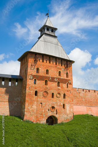 Fototapeta Naklejka Na Ścianę i Meble -  Spasskaya Tower close-up on a sunny July day. Detinets of Veliky Novgorod, Russia