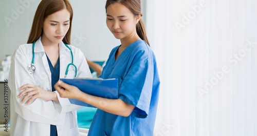Photography portrait of a young female asian doctor professional teamwork consult and sugget
