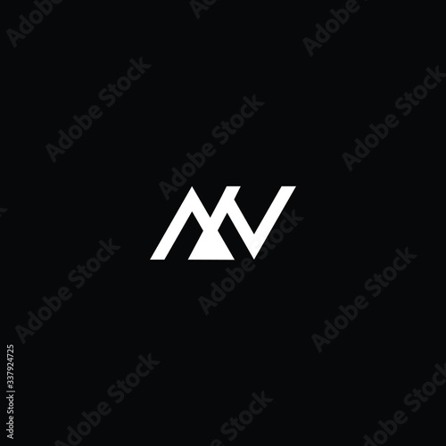 Minimal elegant monogram art logo. Outstanding professional trendy awesome artistic MN NM MV VM initial based Alphabet icon logo. Premium Business logo White color on black background