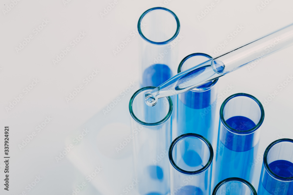 A pipette that adds fluid to one of several tubes. Lab tests A pipette that adds fluid to one of several tubes. Lab tests
