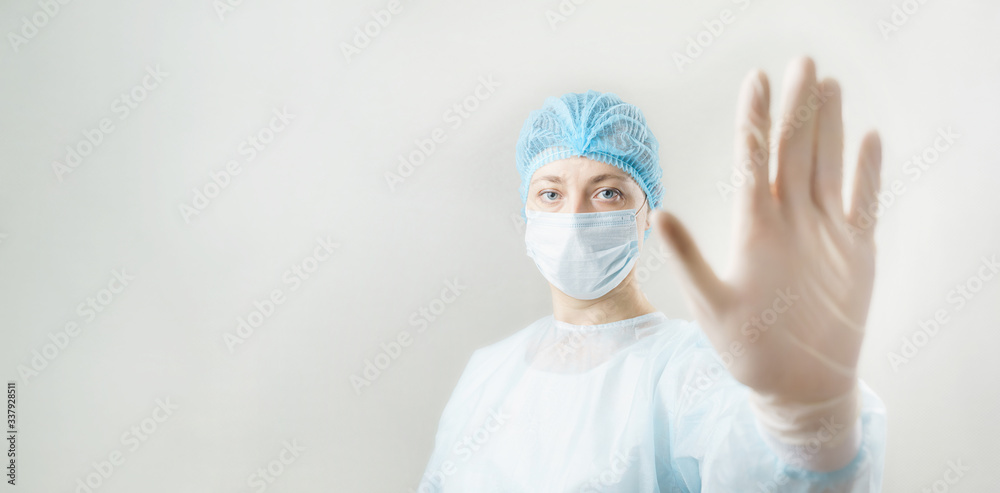 Woman in respirator showing stop gesture. stop viruses concept. Woman in respirator showing stop gesture. stop viruses concept.