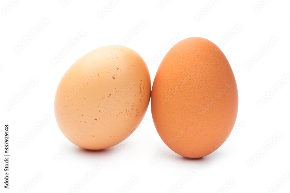 Two fresh brown chicken eggs on a white background Two fresh brown chicken eggs on a white background
