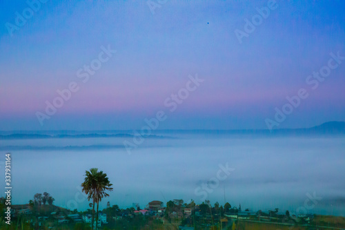 The morning mist floated over the village in the middle of the valley.