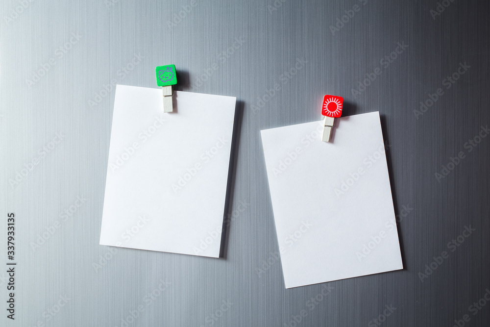 Abstract of Blank paper and stick paper on refrigerator door. paper note with magnet Abstract of Blank paper and stick paper on refrigerator door. paper note with magnet