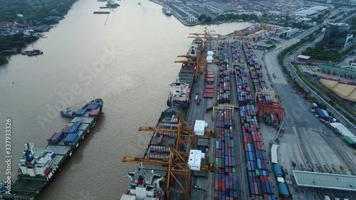 Aerial view of cargo ship, cargo container in warehouse harbor, container ship in import export and business logistic