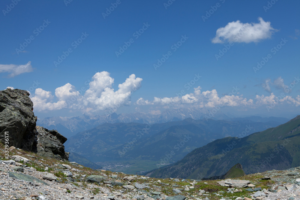 high mountain landscape with clouds, alpine landscape, above the clouds, summer, sunny day