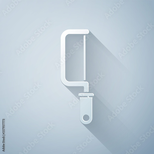 Paper cut Hacksaw icon isolated on grey background. Metal saw for wood and metal. Paper art style. Vector Illustration
