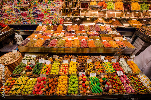 Barcelona, Spain - Sweets counter at public food market in the centre of Barcelona city.